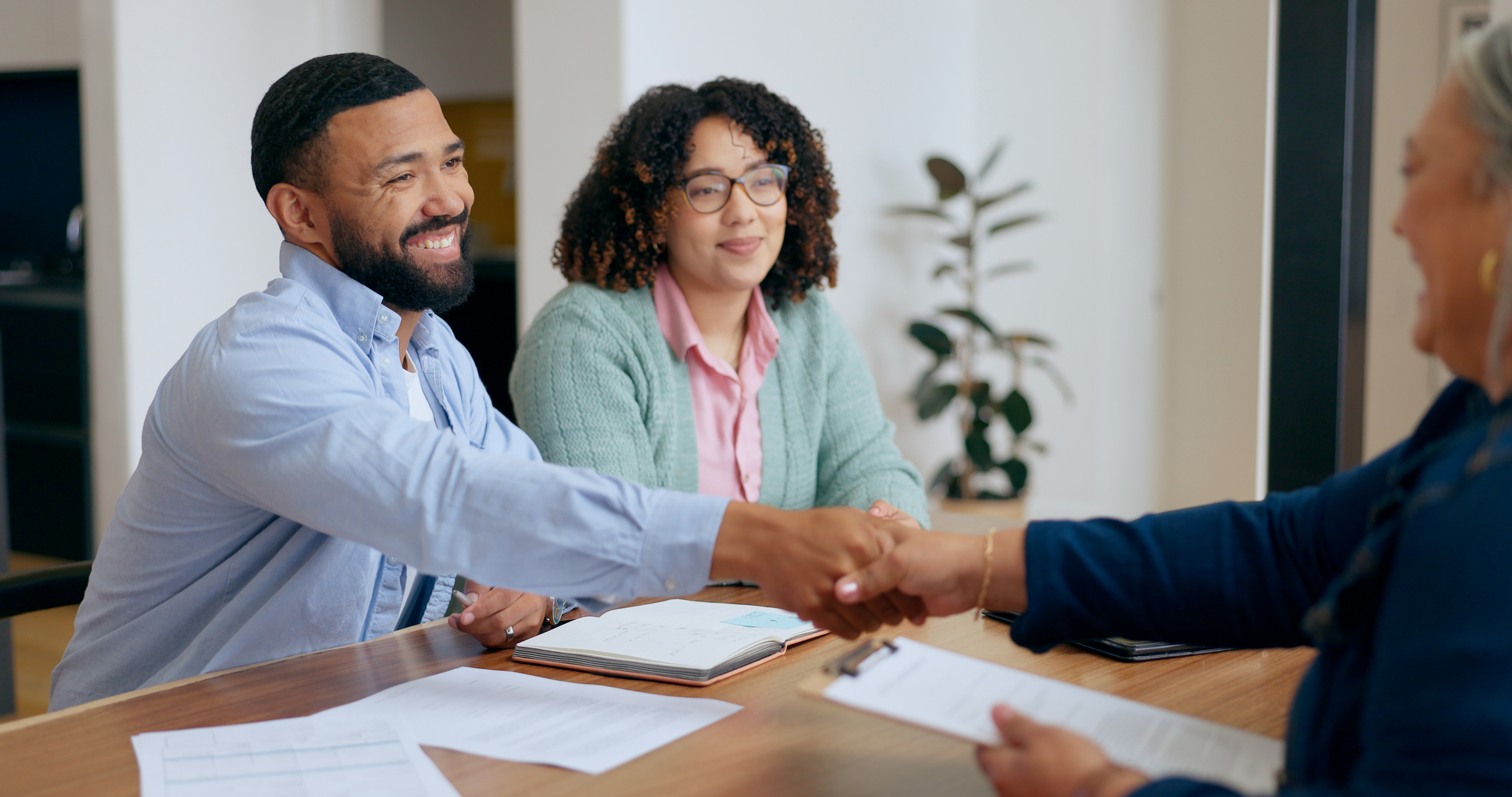 Small-business owners meeting with their plan administrator.